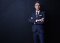 Set your standards high and your financial worth will follow. Studio shot of a confident and mature businessman standing