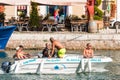 SETE, FRANCE - SEPTEMBER 10, 2017: A group of men in a boat swim