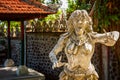 Water Palace of Tirta Gangga in East Bali, Indonesia. Stone statue from asian myths