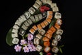 Seth sushi on a black background.Menu of the Japanese restaurant. Several sushi close-ups are beautifully laid out. Traditional Royalty Free Stock Photo