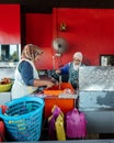 Setiu, Terengganu - May 11, 2022 : Bayu Keropok Lekor workers selling fish sausage crackers