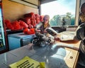 Bayu Keropok Lekor workers selling fish sausage crackers