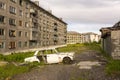 A settlement completely abandoned by people. Abandoned car in the yard. Zapolyarny, Russia