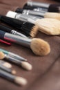 Seto of make up artists brushes laying on the table, clean and ready to use. Space for text Royalty Free Stock Photo