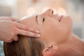 Setting a better intention going forward. a woman receiving a temple massage at a spa. Royalty Free Stock Photo