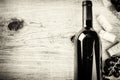 Setting with bottle of red wine, grape and corks. Wine list concept Royalty Free Stock Photo