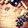 Setting with bottle of red wine, grape and corks. Wine list concept Royalty Free Stock Photo