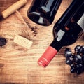 Setting with bottle of red wine, grape and corks. Wine list concept Royalty Free Stock Photo