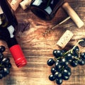 Setting with bottle of red wine, grape and corks. Wine list concept Royalty Free Stock Photo