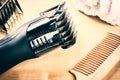 Setting with hair clipper and wooden comb Royalty Free Stock Photo