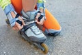 Setting of laces on black roller skates.