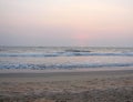 Setting Red Sun at Horizon over Sea at Payyambalam Beach, Kannur, Kerala, India Royalty Free Stock Photo