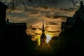 The setting sun behind the Cathedral in the old town of Tallinn , sunset,
