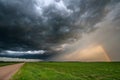 Sunset Casting Light on a Departing Thunderstorm Royalty Free Stock Photo