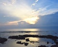 Setting Sun among Clouds over Ocean at Horizon with Bright Golden Sunrays in Sky - Neil Island, Andaman Nicobar, India