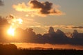 Sunset clouds with tree silhouettes on horizon Royalty Free Stock Photo