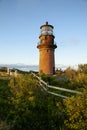 Setting Sun Illuminates Brick Lighthouse Tower in New England