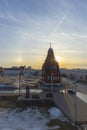 The setting sun illuminates the walls of the old Trinity Church.