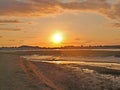 Sunset across the bay at low tide Royalty Free Stock Photo