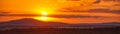 Setting sun on mountain and forests panoramic banner Royalty Free Stock Photo