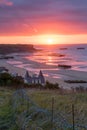 Setting sun on Mulberry Harbours at Arromanche