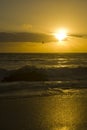 Setting sun and waves Royalty Free Stock Photo