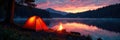 Setting up camp, dusk over tranquil lake, campfire ablaze , reflection, twilight, bonfire Royalty Free Stock Photo