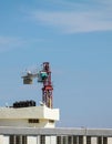 Setting up a tower crane in the construction site Royalty Free Stock Photo