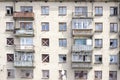 Settled crumbling buildings with broken Windows