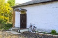 Rural library outside. Bicycle visitor library. The old Soviet building.