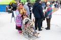 Feast of reindeer herders and fishermans. A woman with a child in national costumes