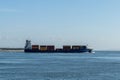 Large freight ship leaving the industrial port at Setubal for a transatlantic crossing