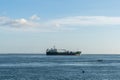 Large freight ship leaving the industrial port at Setubal for a transatlantic crossing