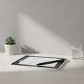 Setup featuring a digital tablet with a stylus resting on it Royalty Free Stock Photo