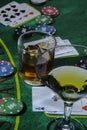 Setup for playing Blackjack at the Casino. WHisky and Martini glasses on the table