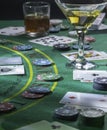 Setup for playing Blackjack at the Casino. WHisky and Martini glasses on the table