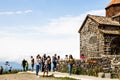 tourists near S Astvatsatsin church in Sevanavank Royalty Free Stock Photo