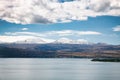 Sevan lake and white clouds blue sky on a sunny day, Armenia Royalty Free Stock Photo