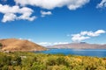 Sevan lake and white clouds blue sky on a sunny day, Armenia Royalty Free Stock Photo