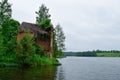 Ruined water mill on the lake. Lakes and rivers.