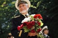 Sevastopol, Ukraine - May 9, 2012: Joyful, smiling World War II Veteran with flowers at the parade during the celebration of `Vic