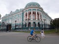 Sevastyanov`s house in Yekaterinburg and passers-by near it. City center Royalty Free Stock Photo