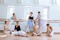 The seven ballerinas at ballet bar