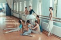 The seven ballerinas at ballet bar