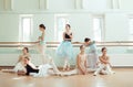 The seven ballerinas at ballet bar