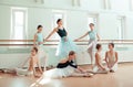 The seven ballerinas at ballet bar Royalty Free Stock Photo