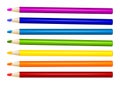 Seven color pencils in arrange in color row on white background