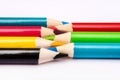 Seven colored pencils. The colors red, green, blue, cyan