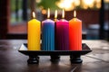 seven colorful candles in a black candle holder Royalty Free Stock Photo