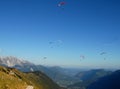 Seven colorful hang-gliders in the blue sky Royalty Free Stock Photo